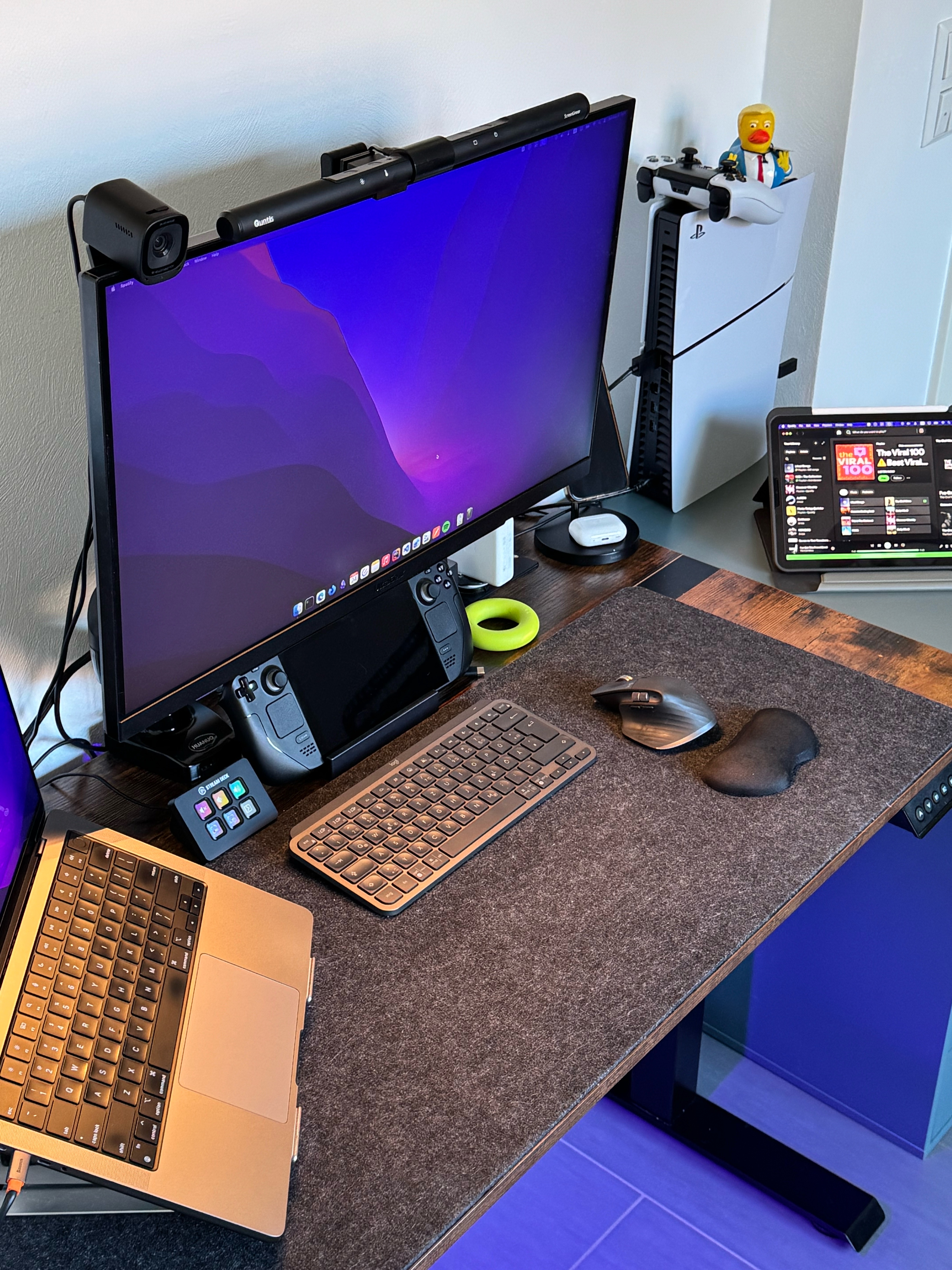 Amirhossein Daraee's development workspace featuring dual monitors, MacBook Pro, and ergonomic desk setup